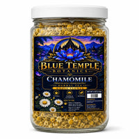 A 4 oz glass jar of Blue Temple Botanics Chamomile Whole Flower herbal tea, featuring a white lid and a dark blue label with a castle and lotus design, filled with chamomile flowers.